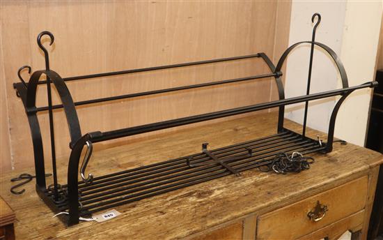 A black painted wrought iron pan rack, L.90cm